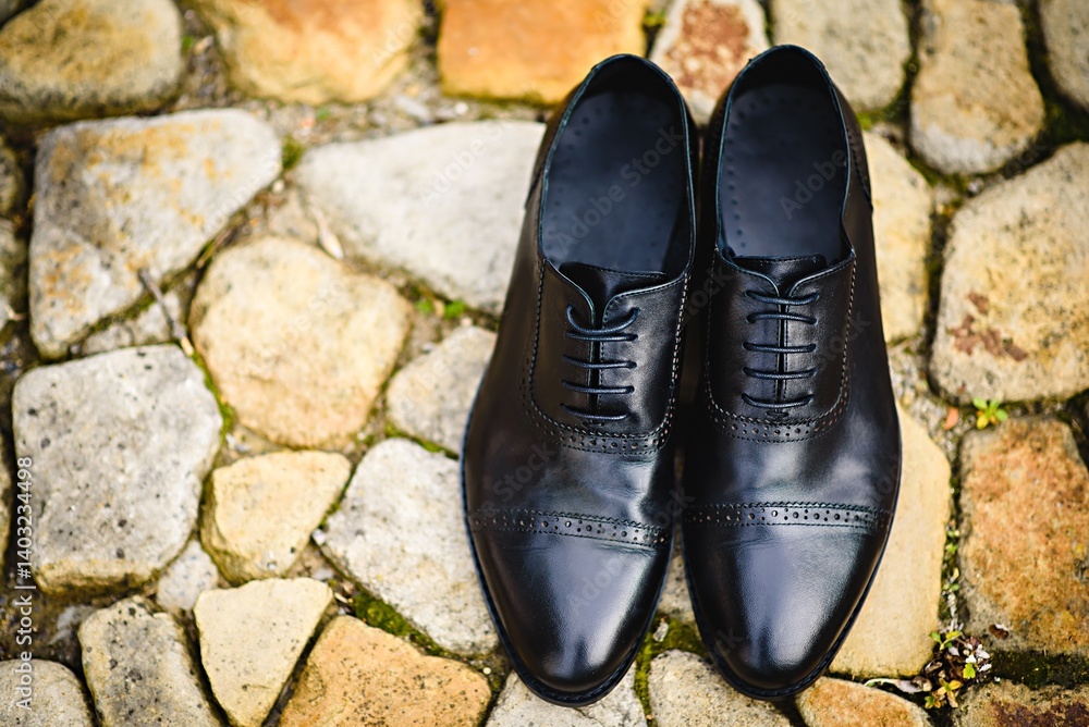 Top view of elegant black men's shoes on stone background Top view of elegant black men's shoes on stone background