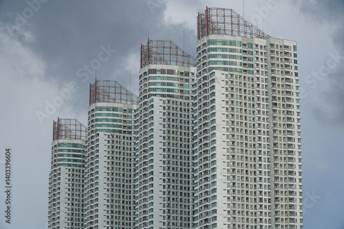 Baywalk Apartment Building Shot From Muara Angke Port Featuring Unique Architectural Design Against Clouds