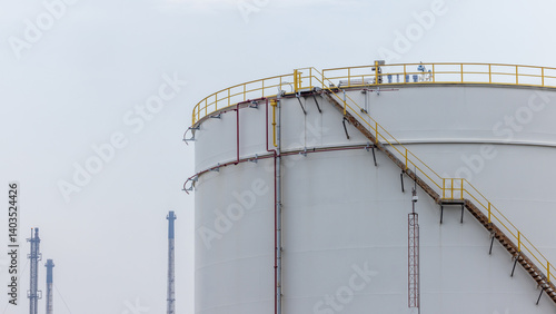 Obraz na płótnie White oil storage tank at oil and gas refinery industrial zone, Business industrial factory oil and gas refinery, Crude oil and gas storage tank business logistic and transportation. w salonie