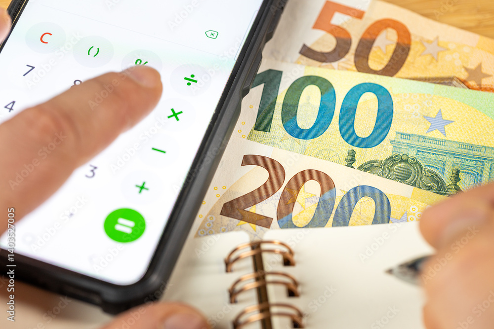 Euro money, Counting on calculator, notes in notebook. Financial settlement, Household budget, Taxes, European Union currency exchange rate, Business Financial Analysis Concept