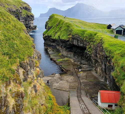The Gjogv village on the Faroe Islands, named after a 200-metre (650 ft) long sea-filled gorge that runs to the sea from the village.