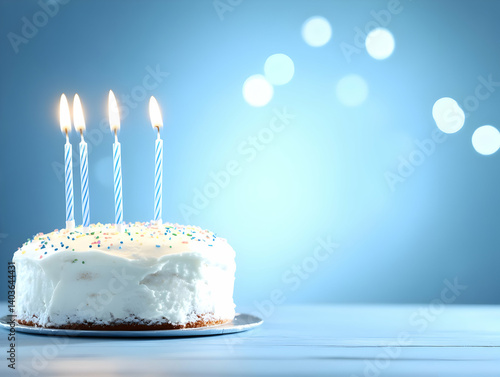 Obraz na płótnie Sweet Birthday Cake with Four Candles on a Plate Against Blue Background with Bokeh Lights w salonie
