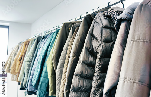 Clothing racks in second-hand store – sustainable fashion, vintage style, and conscious shopping