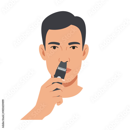 Young man grooming facial hair with a trimmer in a minimalist setting