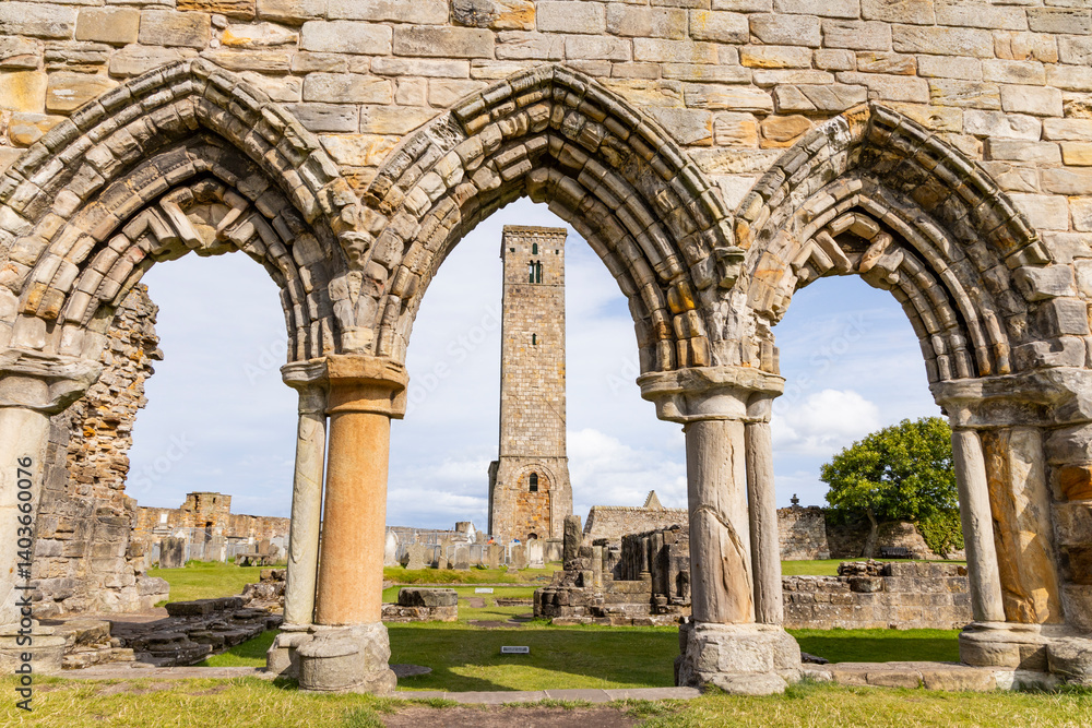 Obraz premium The ruins of St Andrews Cathedral overlook the sea, surrounded by ancient tombs and old stone walls. A peaceful, sacred place filled with religious history and timeless beauty. Endless architecture.