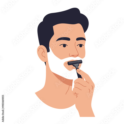 Young man shaving with a razor, applying shaving cream to his face