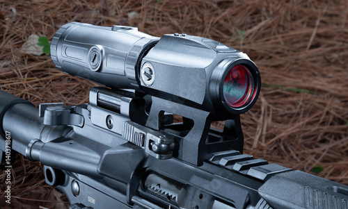 Obraz na płótnie Closeup of a magnifier and red dot sight on an assault rifle w salonie