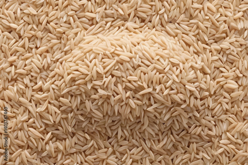 ntegral, uncooked long grain brown rice pile isolated on white background, top view