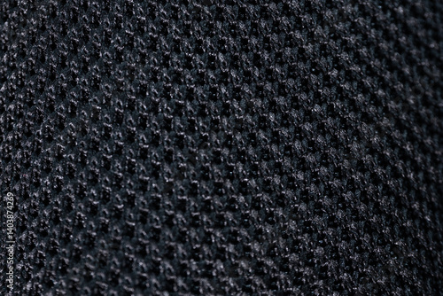 Wallpaper Mural A close-up of a black mesh fabric with a circular knit pattern, highlighting the texture, weave structure and breathability. Ideal for textile and design references. Torontodigital.ca