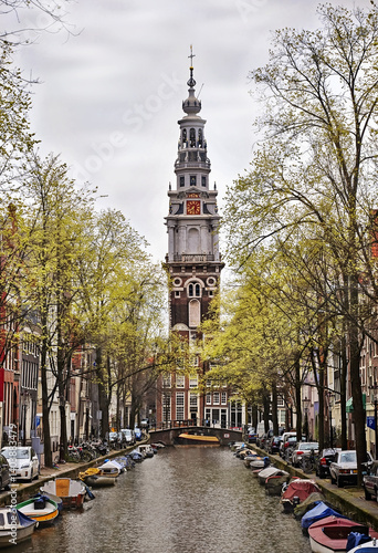 Photography Church and boats moored along the canal in Amsterdam, Holland