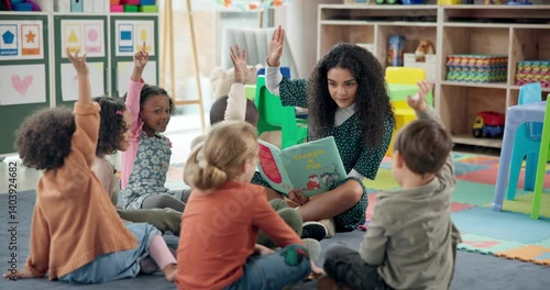 Woman, teacher and story book with hands raised in nursery for question, engagement or interaction. Female person, educator or instructor with elementary kids, answer or novel for listening activity