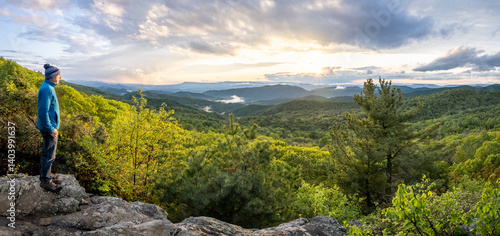 A person, man looking at the setting sun, Blue Ridge Mountains, Grindstone Mountain, Powel Mountain, The Point Overlook, Shenandoah National Park, Virginia