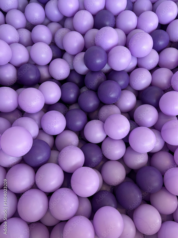 Colorful textured pattern made of plastic balls in different shades of purple Colorful textured pattern made of plastic balls in different shades of purple