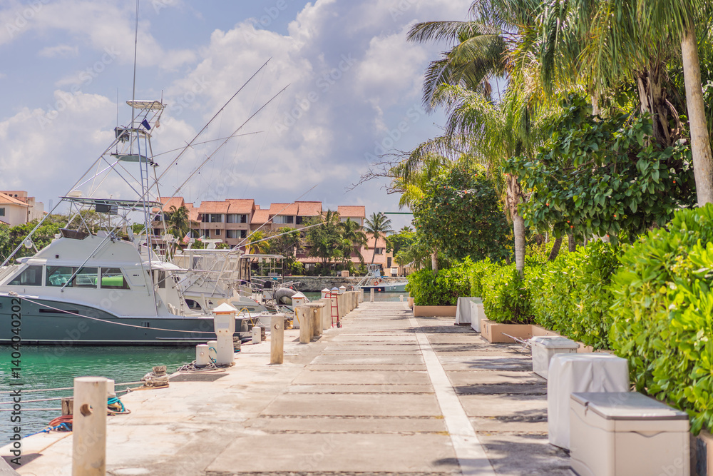 A scenic marina filled with luxurious yachts docked in calm waters, reflecting the beauty of a coastal lifestyle. A serene and elegant setting representing travel, wealth, relaxation, and nautical