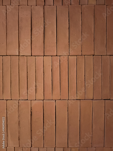 Obraz na płótnie Stacked terracotta bricks forming a textured wall background w salonie