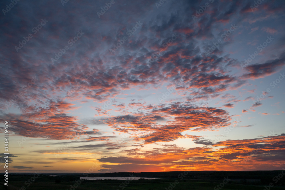 Light Pink Clouds Turn To Orange At Sunrise Over Kansas