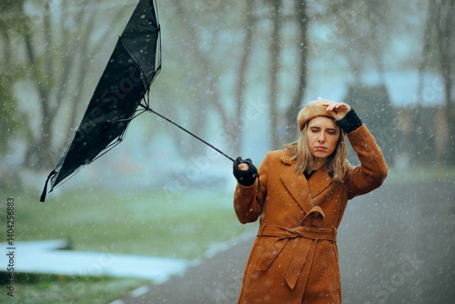 Tableau sur toile Woman with an Umbrella Broken by a Snowstorm