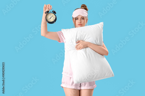 Sleepy young woman with ala...