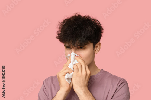 Young man with runny nose o...