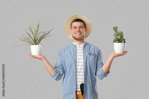 Young male gardener with ho...