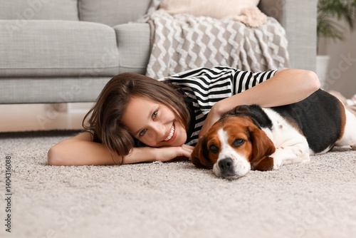 Young woman lying on floor ...