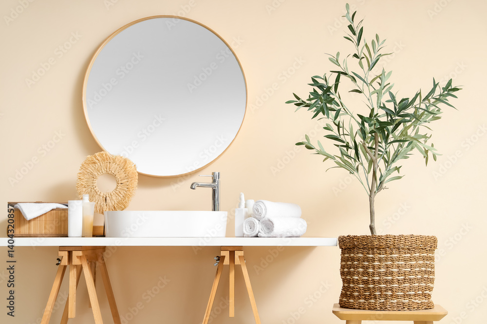 Interior of modern bathroom with decorative olive tree
