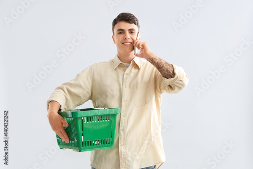 Young man with shopping bas...
