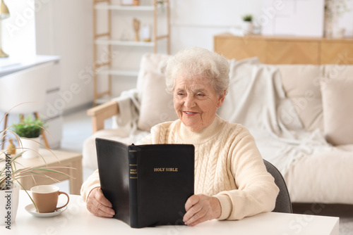 Smiling senior woman readin...