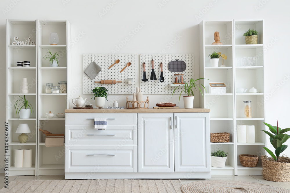 Shelving units, counter and peg board in kitchen Shelving units, counter and peg board in kitchen