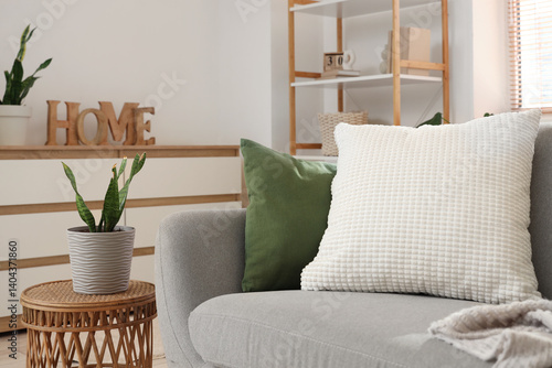 Obraz na płótnie Soft cushions on grey sofa in living room w salonie