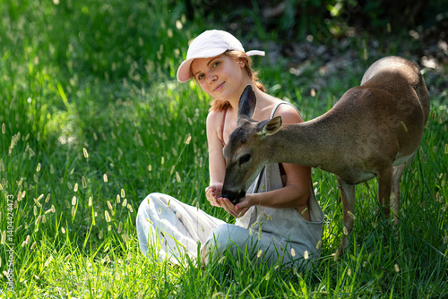 Photography Woman feed fawn deer