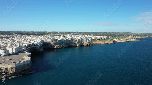 Wallpaper Mural Polignano a Mare by the clear waters in Europe, Italy, Puglia, near Bari, in summer, on a sunny day.  Torontodigital.ca