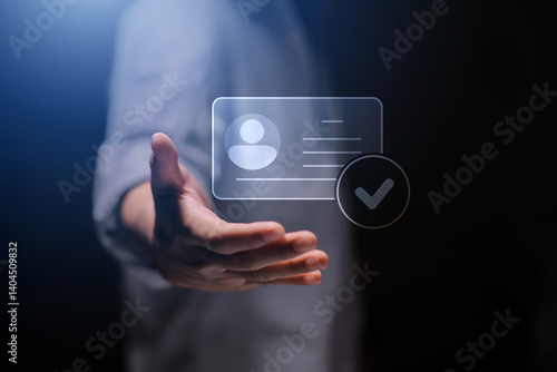 human hand holding digital identification card, with Checkmark Icons for Identity verification, ID card with checkmark. Personality approve. Employee badge.