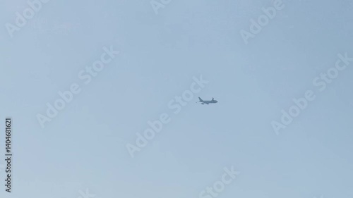 The plane flies in the blue sky. High quality FullHD footage