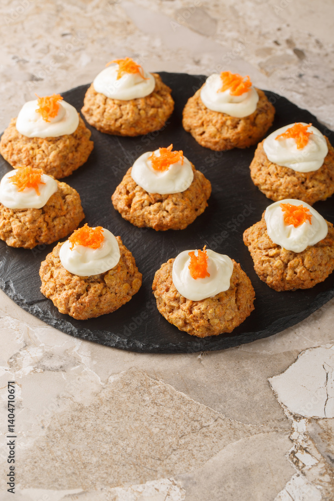 Cream Cheese Carrot Cake Cookies close up on the plate on the table. Vertical