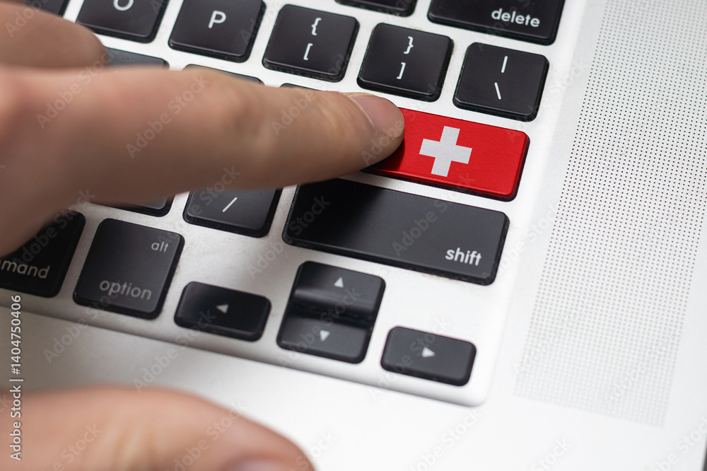 Close up of Switzerland flag on computer keyboard