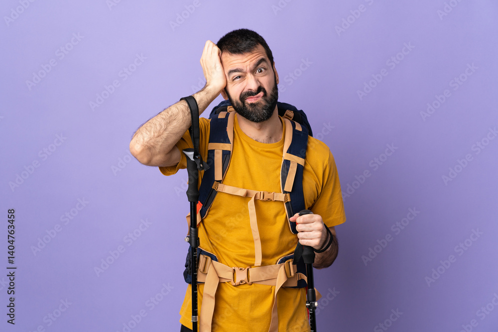 Caucasian handsome man with backpack and trekking poles over isolated background with an expression of frustration and not understanding