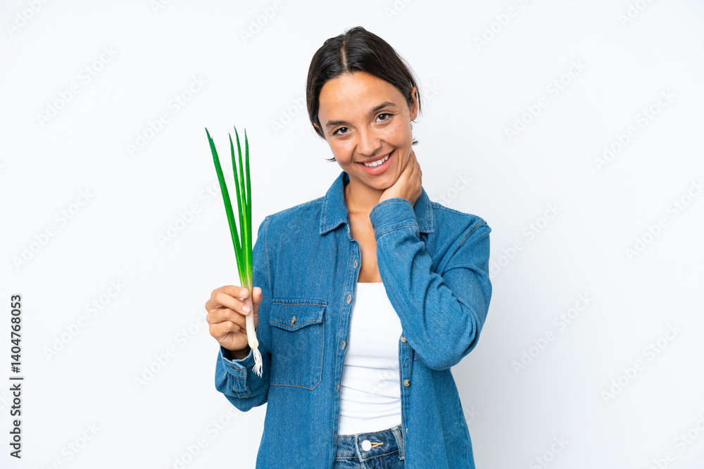 Young hispanic woman holding chive isolated on white background laughing Young hispanic woman holding chive isolated on white background laughing