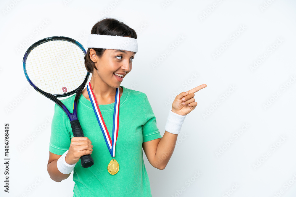 Young tennis player woman isolated on white background pointing finger to the side and presenting a product Young tennis player woman isolated on white background pointing finger to the side and presenting a product