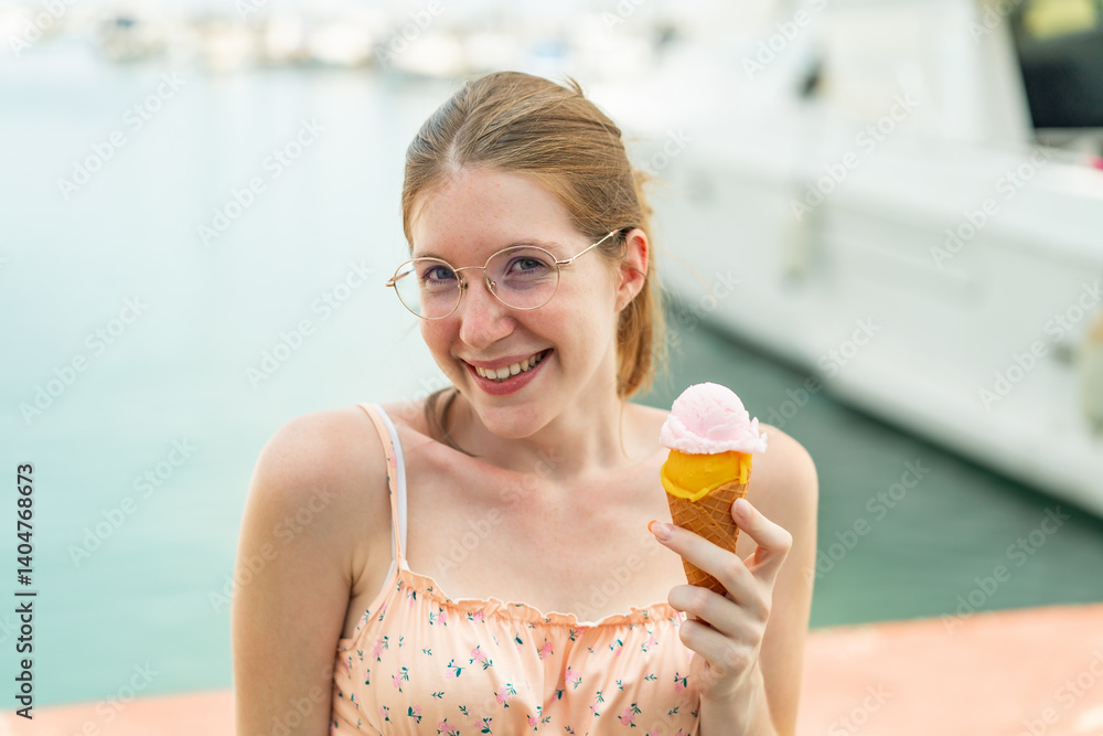 French girl with glasses holding a cornet ice cream at outdoors with surprise and shocked facial expression French girl with glasses holding a cornet ice cream at outdoors with surprise and shocked facial expression