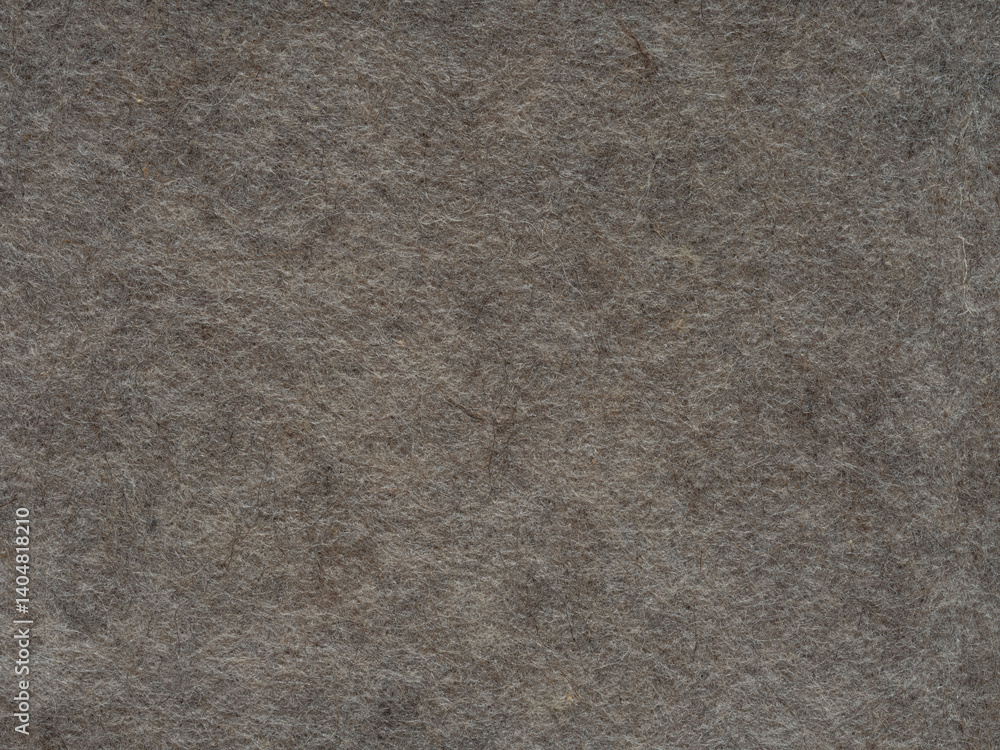 The intricate weave of this heather gray felt texture speaks of quiet complexity and the elegance of simplicity