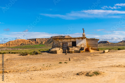 Desolated building emerging from the bardenas reales desert in navarre, spain