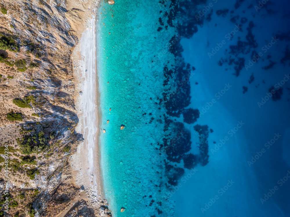 Aerial top view of the beautiful coast of Alonissos island with remote beaches and turquoise, clear sea, Sporades, Greece