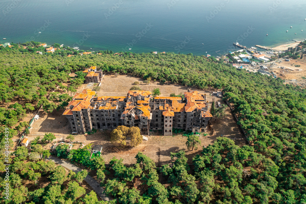 Buyukada Greek Orphanage. Aerial view of the Buyukada Greek Orphanage on a coastal hill surrounded by lush vegetation with the sea in the background. Istanbul, Turkey.