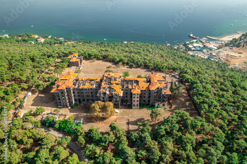 Obraz na płótnie Buyukada Greek Orphanage. Aerial view of the Buyukada Greek Orphanage on a coastal hill surrounded by lush vegetation with the sea in the background. Istanbul, Turkey. w salonie