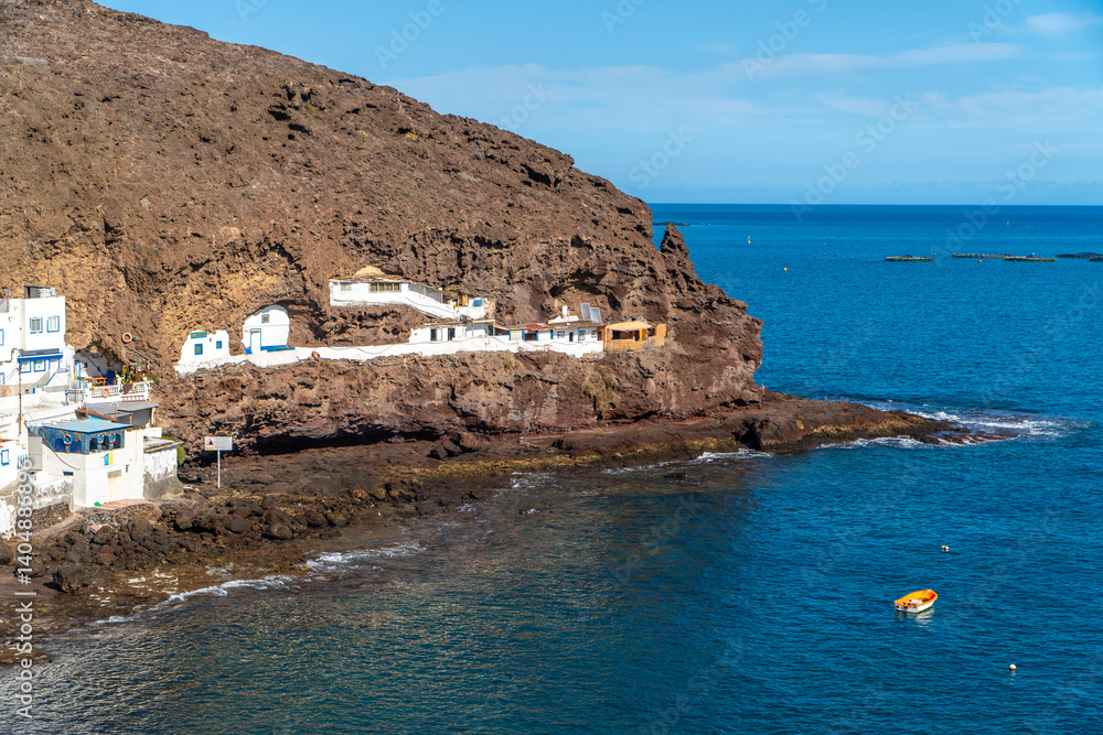 Tufia village perched on volcanic cliffs in gran canaria, canary islands, spain