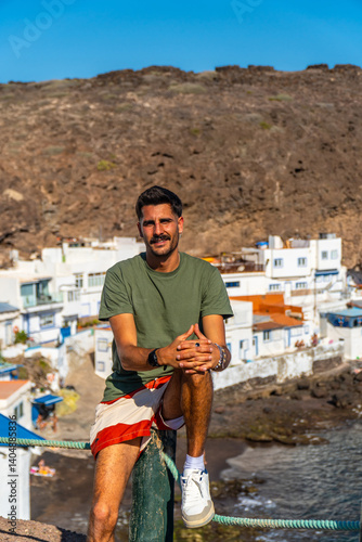 Tourist relaxing in tufia, gran canaria, canary islands, spain