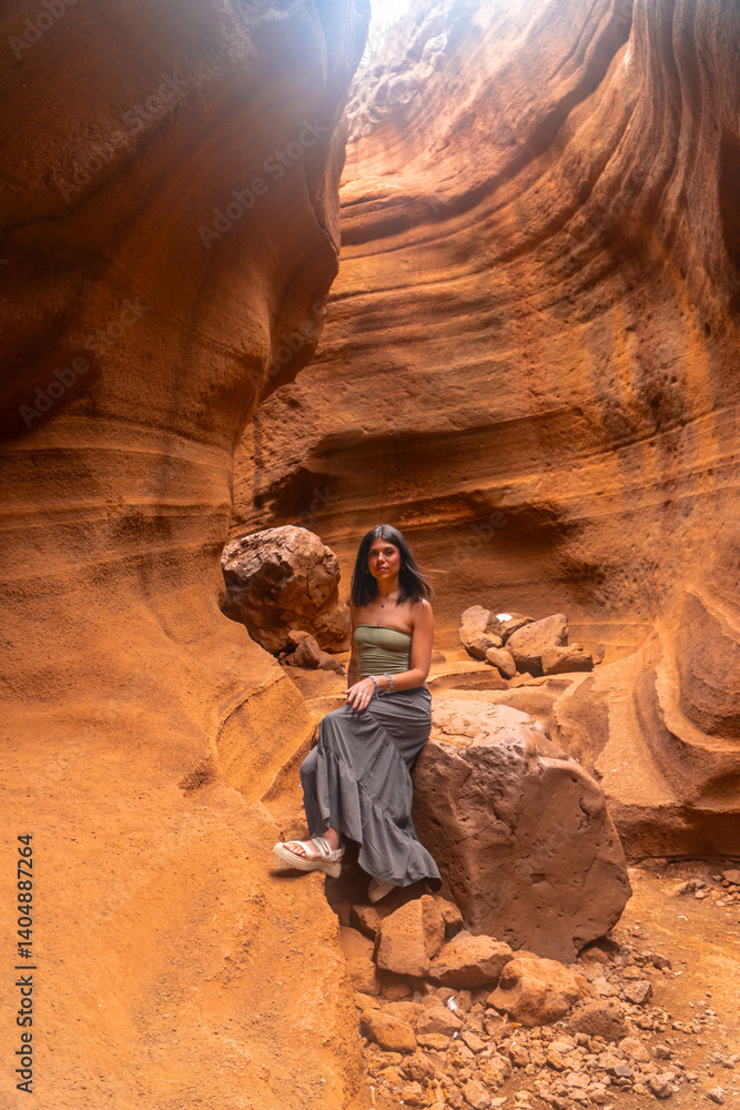 Tourist exploring the majestic barranco de las vacas in gran canaria