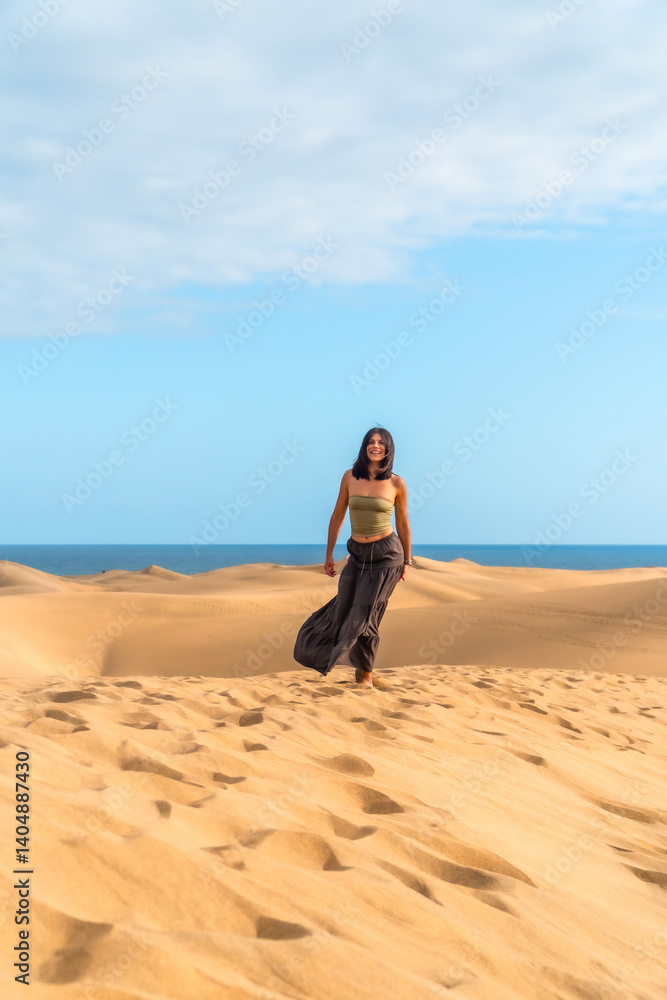 Tourist walking on maspalomas dunes in gran canaria, spain