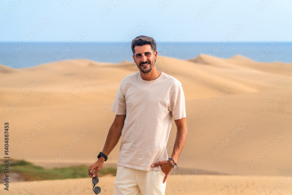 Tourist smiling in maspalomas dunes, gran canaria, spain